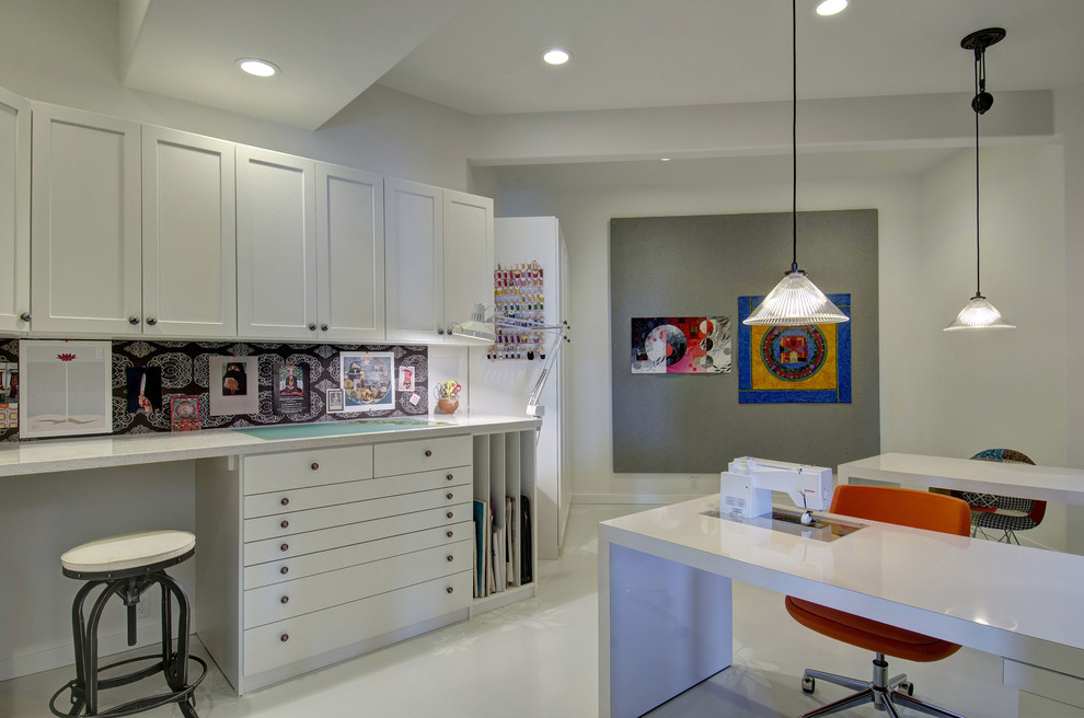 Photo of a mid-sized transitional craft room in Denver with grey walls, porcelain floors, no fireplace, a built-in desk and white floor.