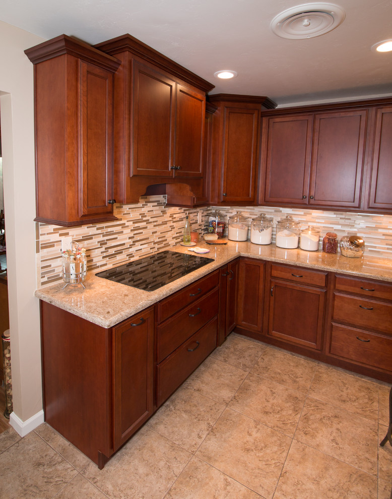 Example of a large transitional u-shaped porcelain tile kitchen design with an undermount sink, flat-panel cabinets, medium tone wood cabinets, quartz countertops, beige backsplash, mosaic tile backsplash, stainless steel appliances and an island