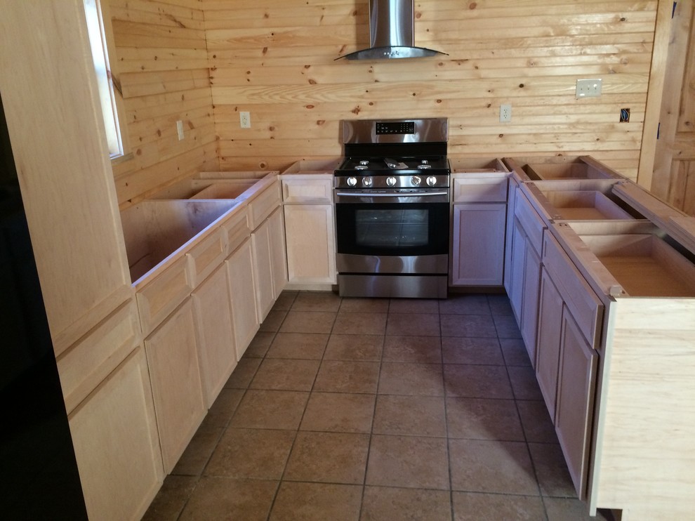 Example of a small mountain style u-shaped kitchen design in DC Metro with a double-bowl sink, recessed-panel cabinets, light wood cabinets, granite countertops, beige backsplash, wood backsplash, stainless steel appliances, brown countertops and a peninsula