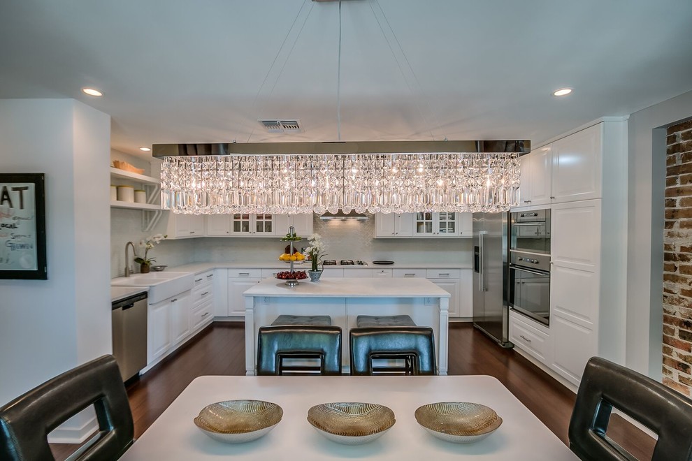 Mid-sized transitional medium tone wood floor and brown floor kitchen/dining room combo photo in Phoenix with white walls and no fireplace
