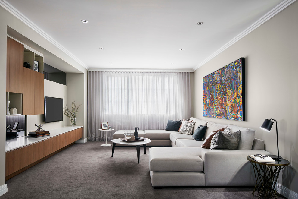 Design ideas for a mid-sized traditional open concept family room in Melbourne with carpet and a built-in media wall.