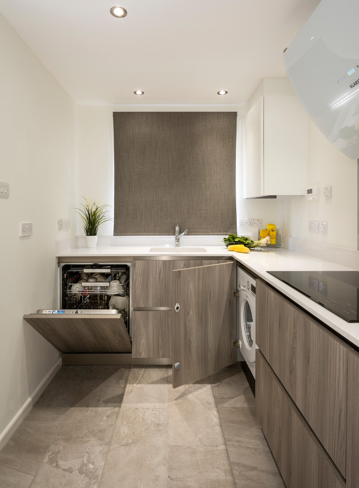 Design ideas for a small contemporary galley separate kitchen in Devon with an integrated sink, flat-panel cabinets, solid surface benchtops and white benchtop.