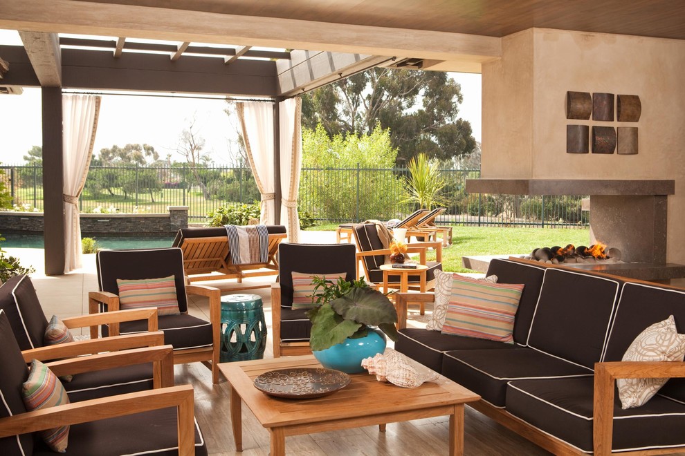 Inspiration for a contemporary patio in Orange County with a fire feature and a pergola.