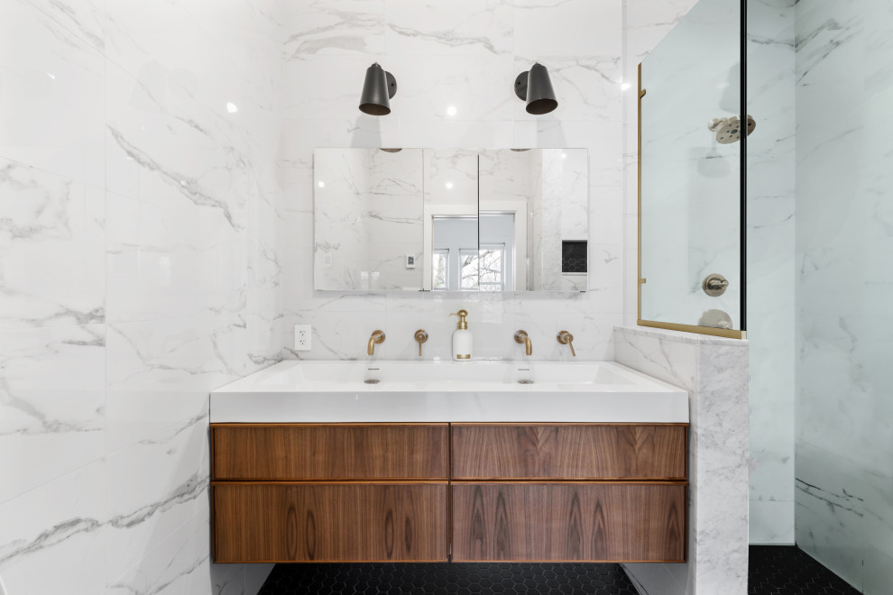 This is an example of a mid-sized transitional master bathroom in New York with dark wood cabinets, white tile, ceramic tile, a double vanity and a floating vanity.