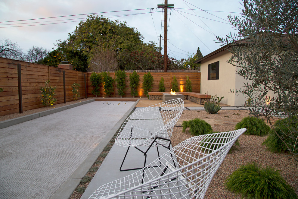 Design ideas for a large modern backyard patio in San Luis Obispo with an outdoor kitchen, concrete slab and a pergola.