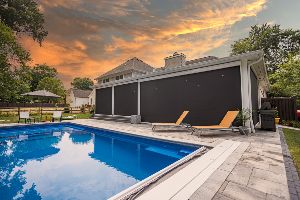 Pool - large transitional backyard rectangular lap pool idea in Cincinnati