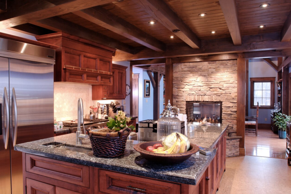 Inspiration for a large rustic galley dark wood floor open concept kitchen remodel in Boston with an undermount sink, shaker cabinets, white cabinets, granite countertops, stainless steel appliances and an island