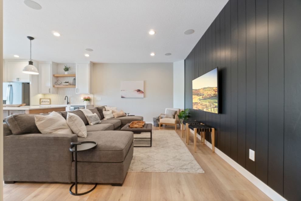 Inspiration for a medium sized modern formal open plan living room in Minneapolis with black walls, vinyl flooring, a wall mounted tv, beige floors and tongue and groove walls.
