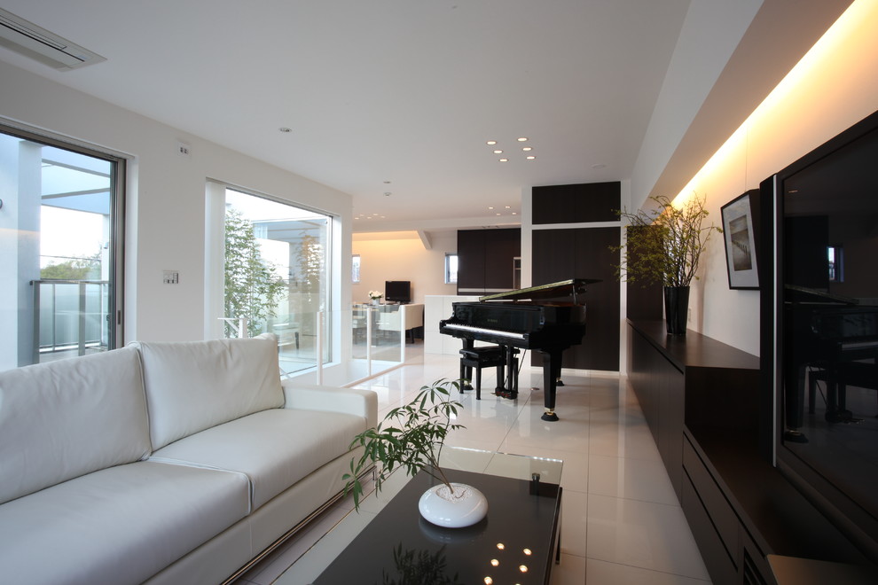 Photo of a mid-sized modern open concept living room in Tokyo Suburbs with a music area, white walls, ceramic floors, no fireplace and a freestanding tv.