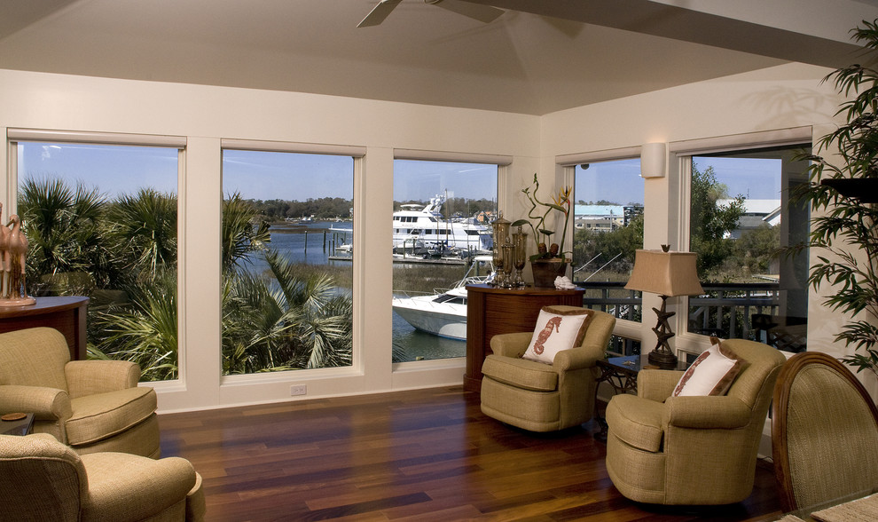 Inspiration for a mid-sized beach style sunroom in Wilmington with medium hardwood floors, a standard ceiling and brown floor.