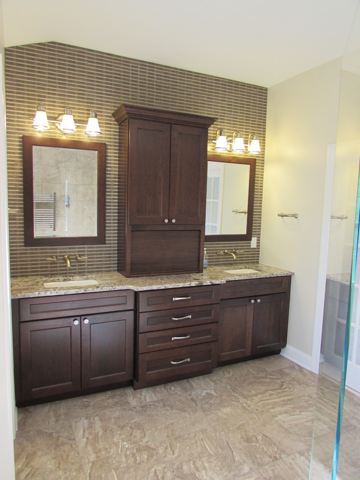 Design ideas for a large transitional master bathroom in DC Metro with an undermount sink, dark wood cabinets, granite benchtops, a curbless shower, beige tile, ceramic tile, beige walls and ceramic floors.