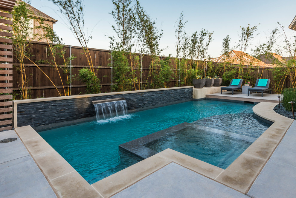 Design ideas for a small transitional backyard custom-shaped pool in Dallas with concrete slab.