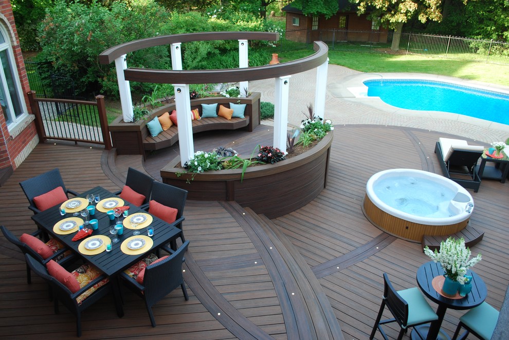 Large contemporary backyard deck in Toronto with a fire feature and no cover.