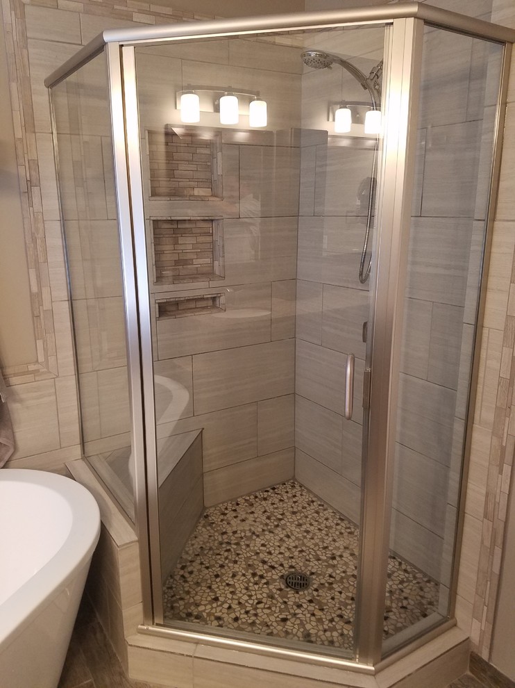 Photo of a mid-sized transitional master bathroom in Salt Lake City with shaker cabinets, dark wood cabinets, a freestanding tub, a corner shower, a two-piece toilet, brown tile, ceramic tile, beige walls, porcelain floors, an undermount sink and quartzite benchtops.