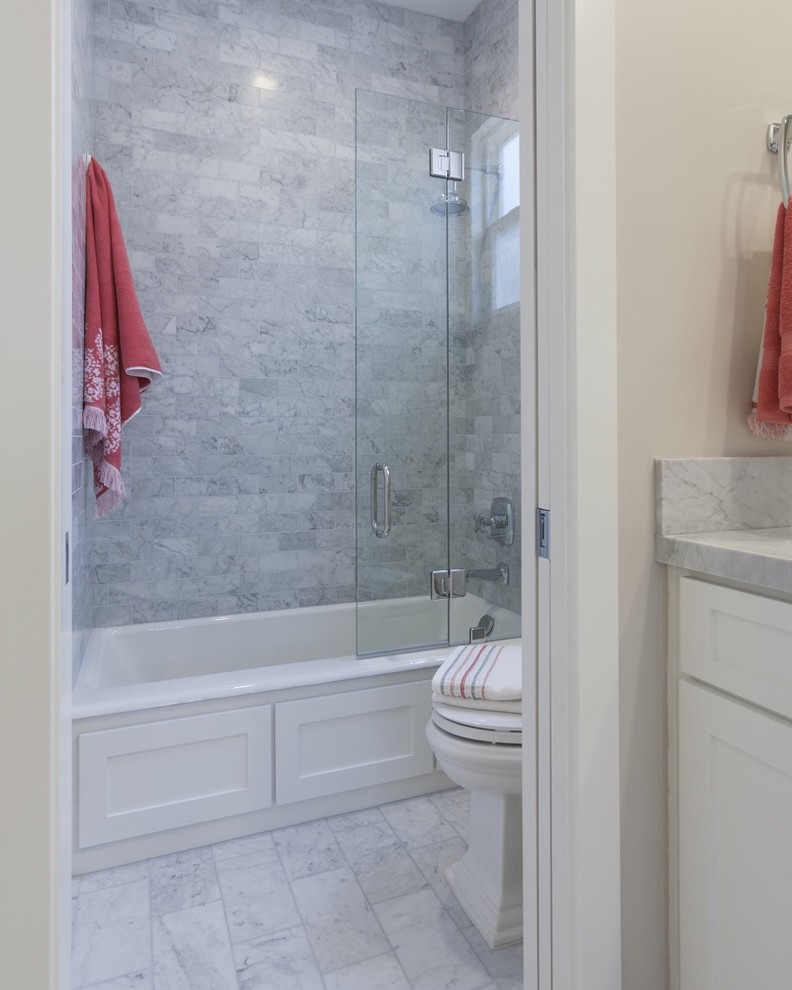 Inspiration for a mid-sized transitional 3/4 bathroom in Los Angeles with shaker cabinets, yellow cabinets, an alcove tub, a shower/bathtub combo, beige walls, marble floors, an undermount sink, marble benchtops, white floor and an open shower.