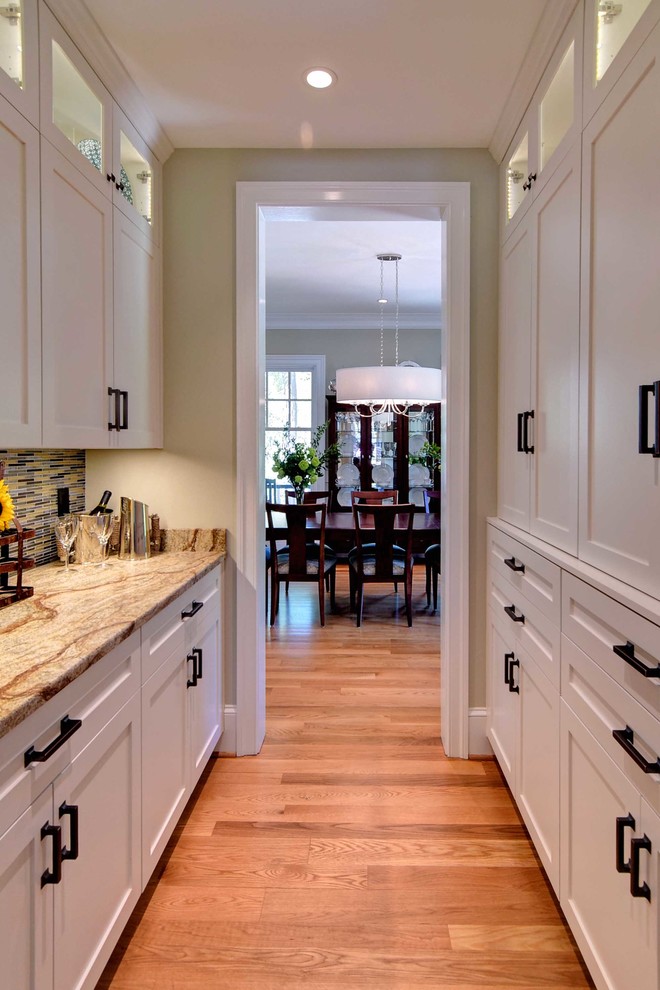 Inspiration for a transitional medium tone wood floor dining room remodel with beige walls