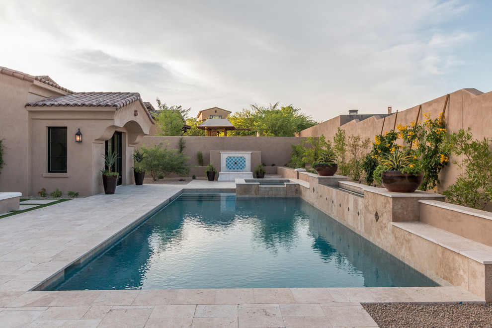 Huge transitional two-story stucco beige pool photo in Phoenix with a tile roof