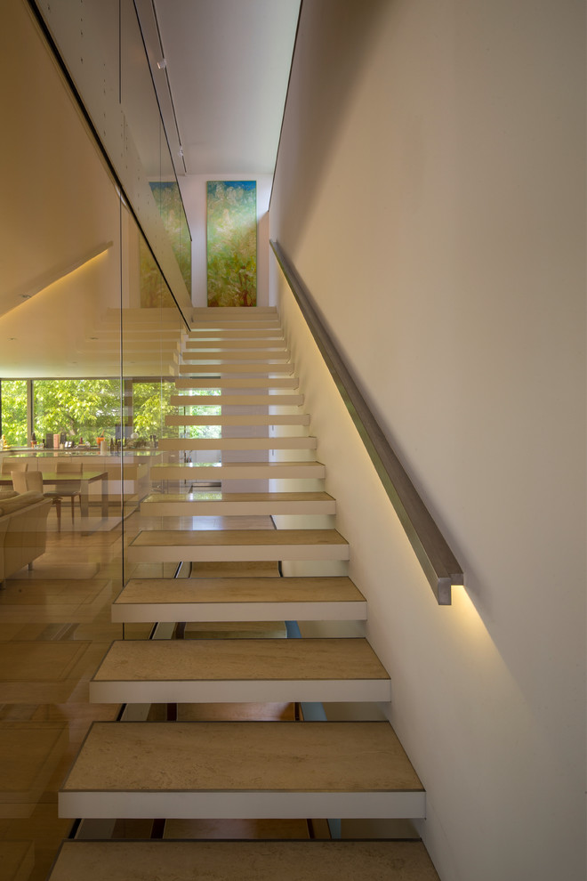 This is an example of a mid-sized contemporary straight staircase in Other with open risers.