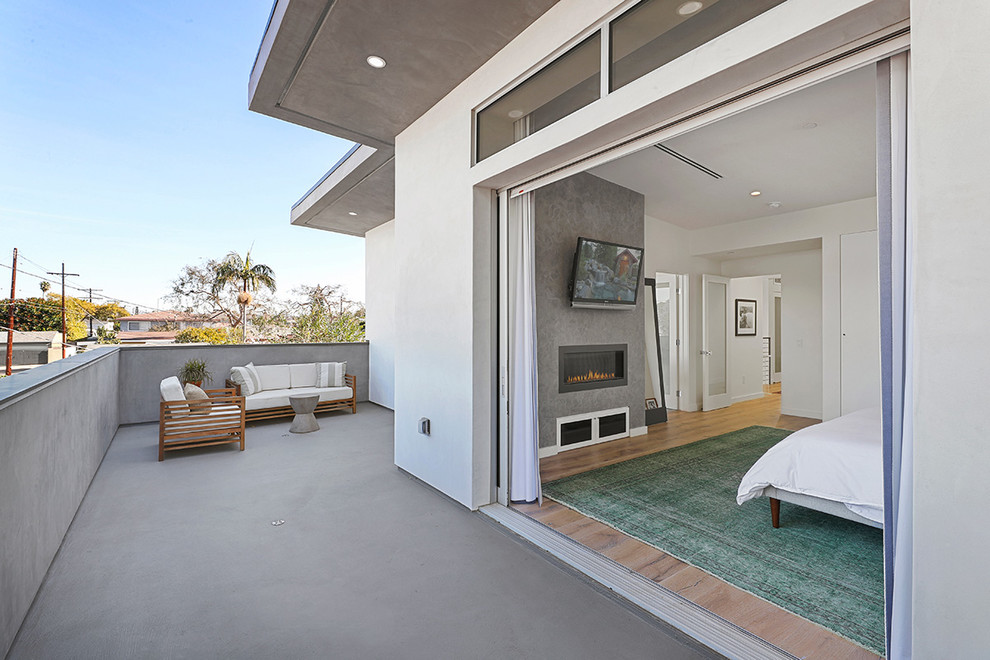 This is an example of a large modern balcony in Los Angeles with no cover.