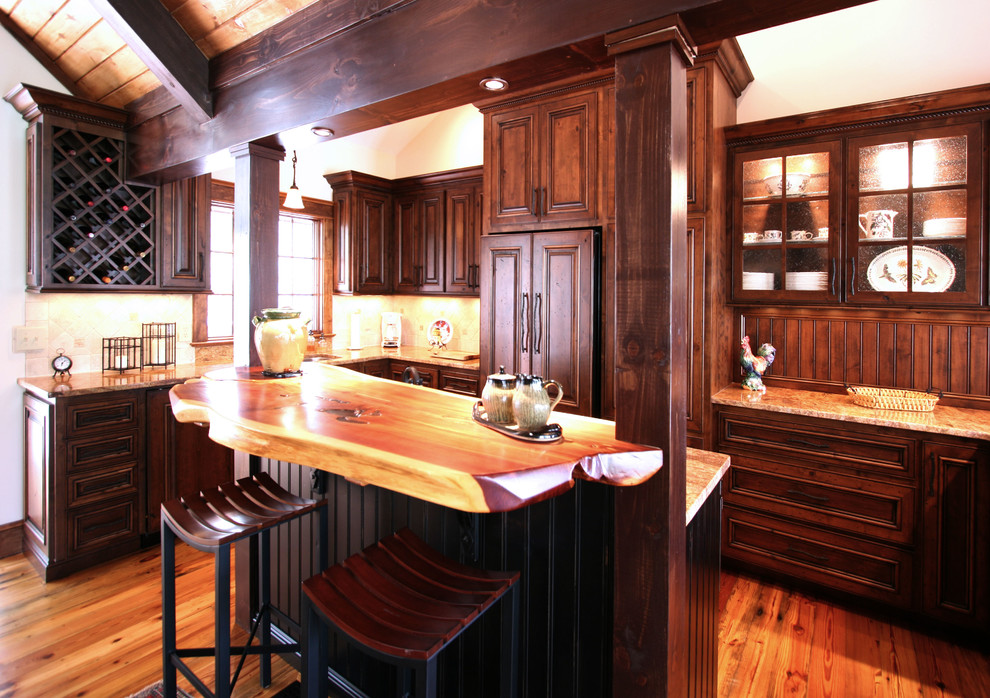 Design ideas for a country eat-in kitchen in Charlotte with an undermount sink and medium wood cabinets.