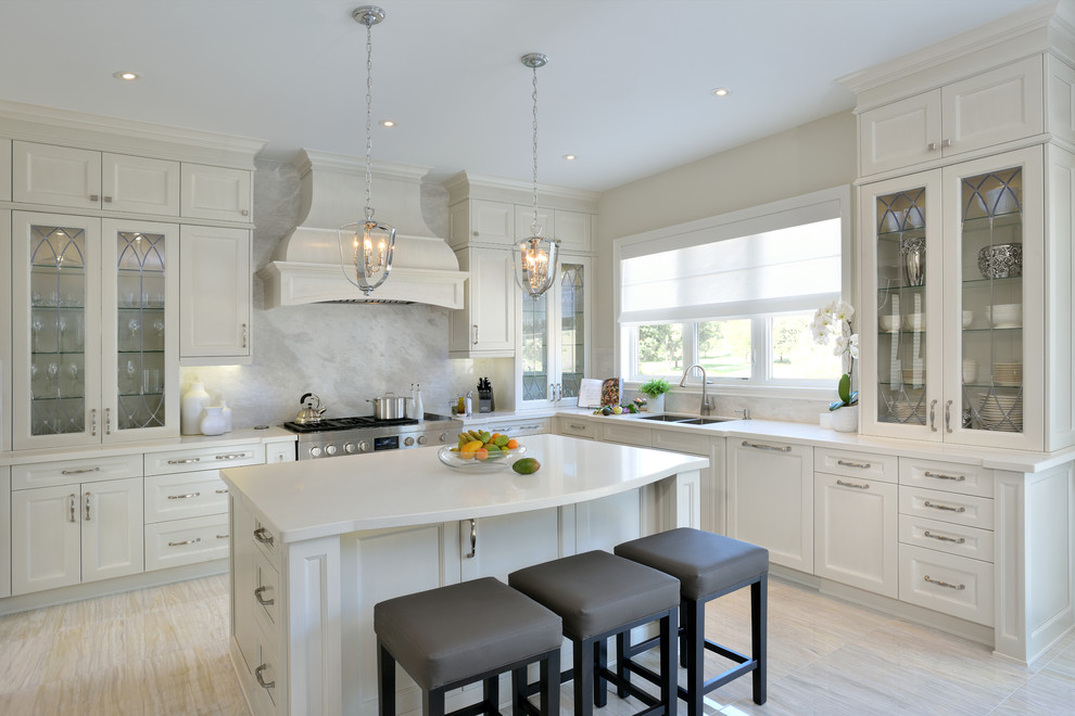 Example of a large transitional l-shaped eat-in kitchen design in Toronto with an undermount sink, recessed-panel cabinets, white cabinets, marble countertops, gray backsplash, stone slab backsplash, stainless steel appliances and an island