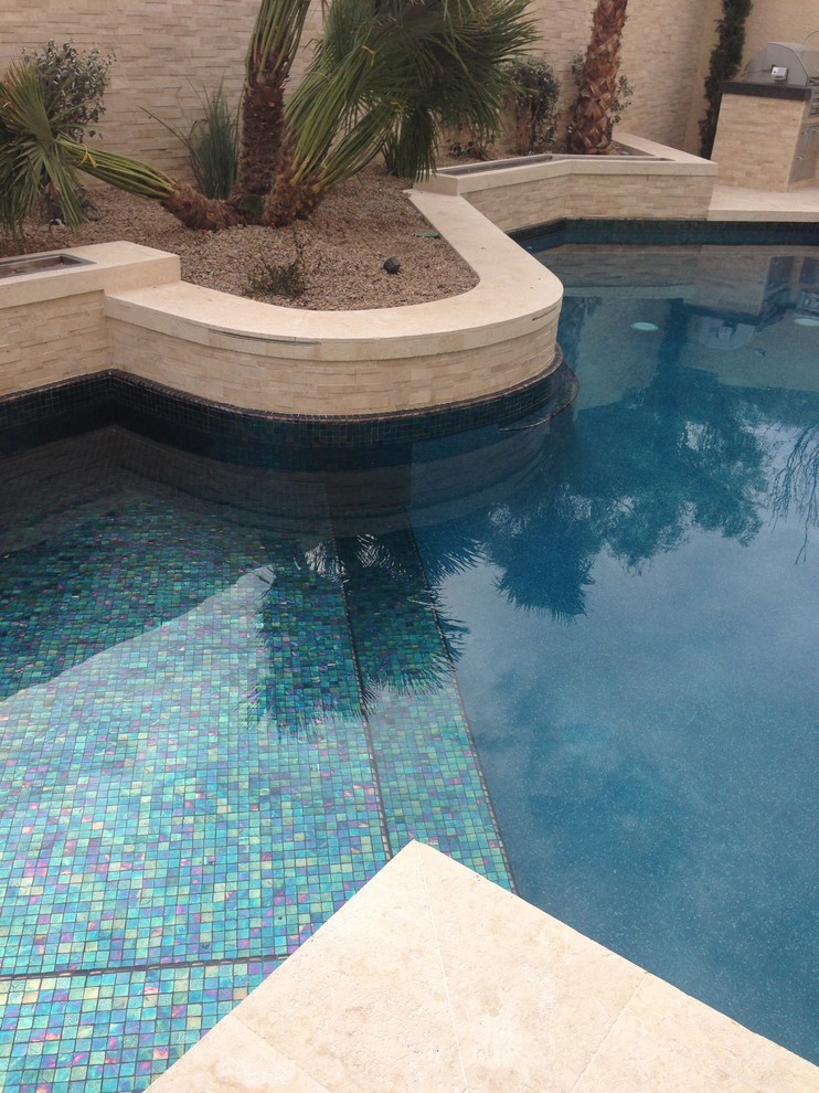 This is an example of a mid-sized mediterranean pool in Las Vegas.