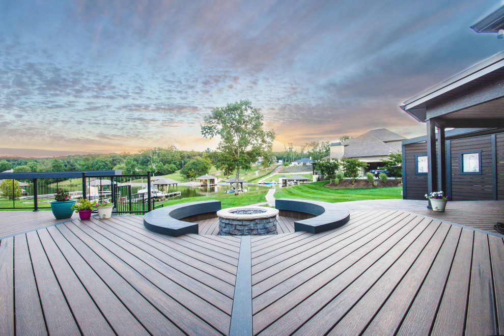 Large transitional backyard deck photo with a fire pit and no cover