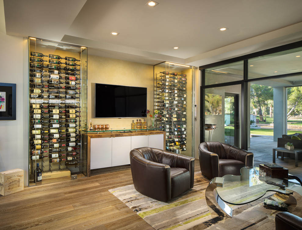 Inspiration for a mid-sized modern wine cellar in Phoenix with display racks, ceramic floors and grey floor.