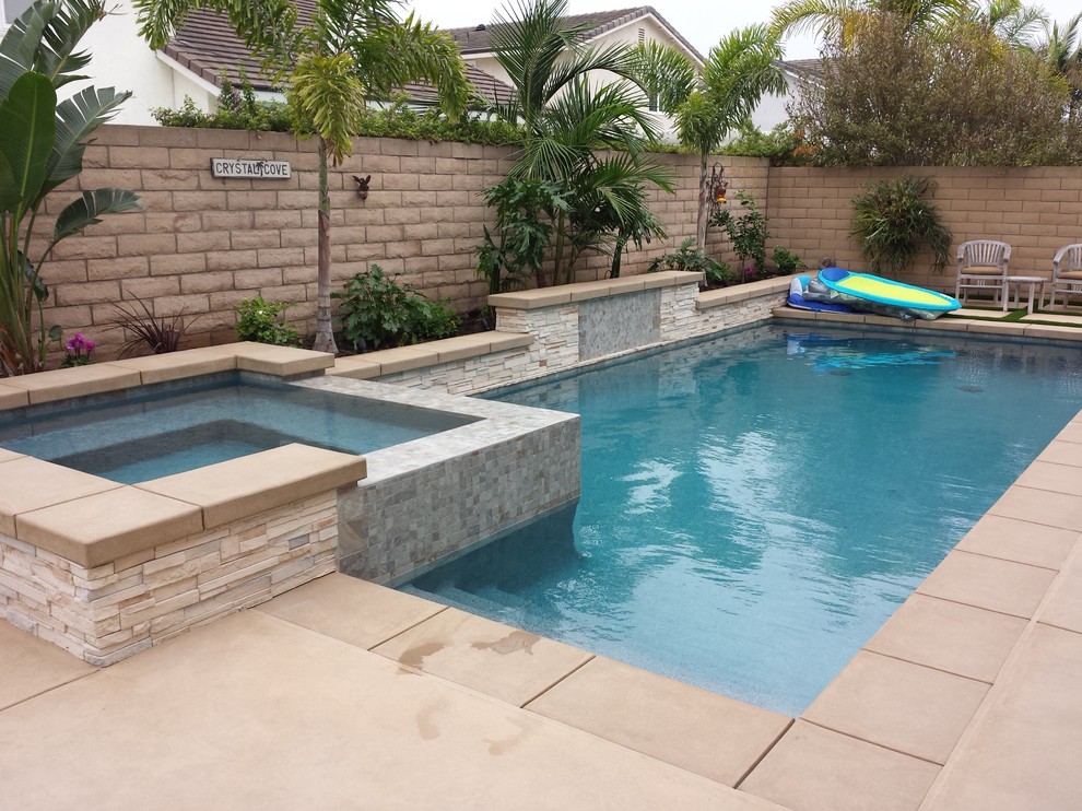 Design ideas for a small contemporary pool in Orange County with a hot tub.