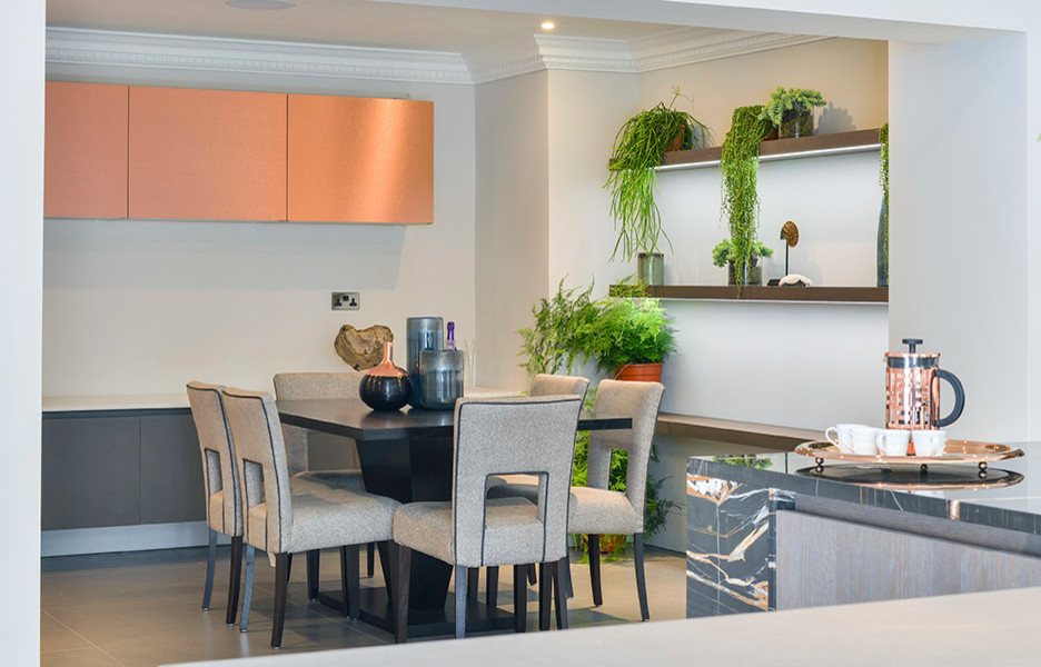 Photo of a contemporary kitchen/dining combo in London with white walls.