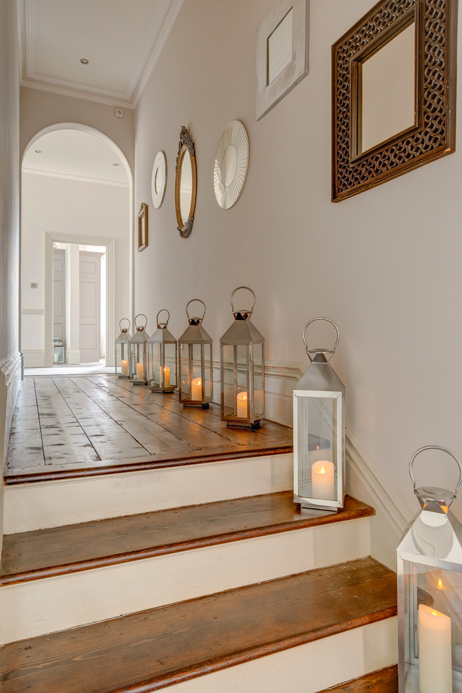 This is an example of a traditional hallway in Devon with medium hardwood floors.