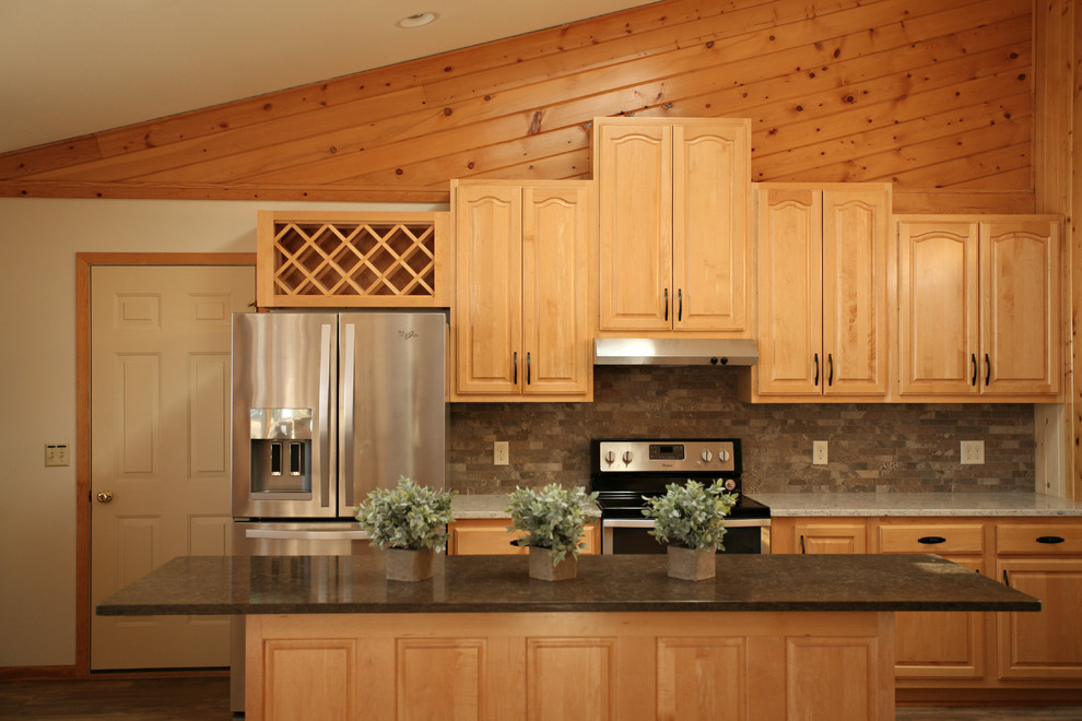 Open concept kitchen - mid-sized rustic l-shaped medium tone wood floor and brown floor open concept kitchen idea with a double-bowl sink, raised-panel cabinets, light wood cabinets, quartz countertops, gray backsplash, stone tile backsplash, stainless steel appliances and an island