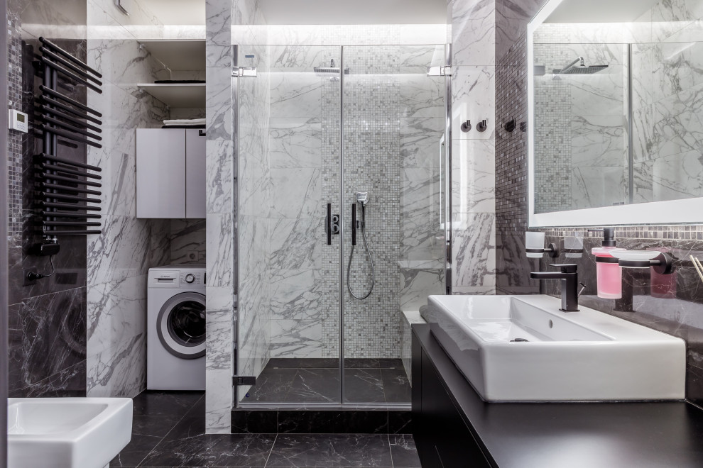 Inspiration for a mid-sized contemporary 3/4 bathroom in Other with flat-panel cabinets, black cabinets, a wall-mount toilet, black and white tile, porcelain tile, marble floors, granite benchtops, black floor, black benchtops, a floating vanity, a vessel sink, a hinged shower door and a single vanity.