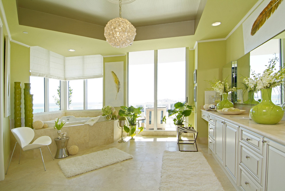 Inspiration for a mid-sized contemporary master beige tile and stone tile travertine floor and beige floor doorless shower remodel in Miami with marble countertops, green walls, an undermount sink, raised-panel cabinets, beige cabinets, a hot tub, a one-piece toilet and beige countertops