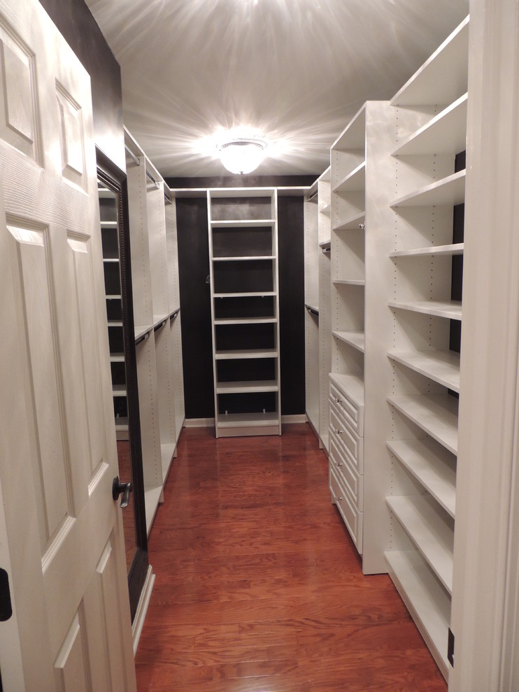 Photo of a large traditional gender-neutral walk-in wardrobe in Philadelphia with raised-panel cabinets and white cabinets.