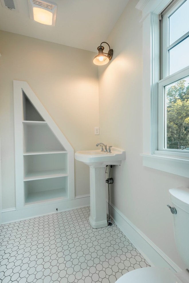 Inspiration for a small country 3/4 bathroom in Other with white walls, mosaic tile floors, a pedestal sink, a claw-foot tub, a shower/bathtub combo, a two-piece toilet and white floor.