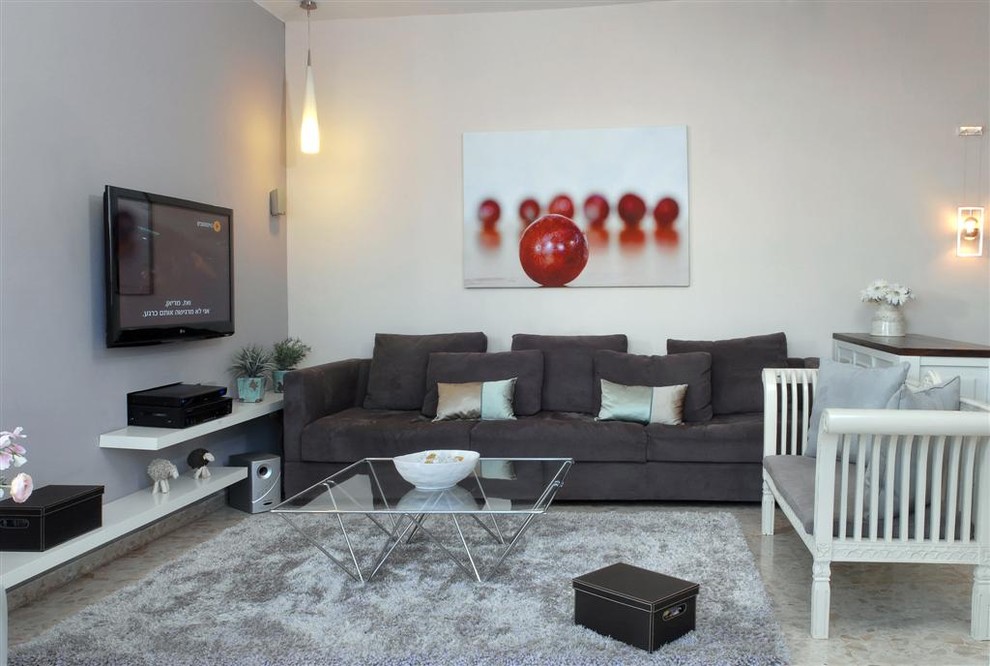 Contemporary family room in Other with grey walls and a wall-mounted tv.
