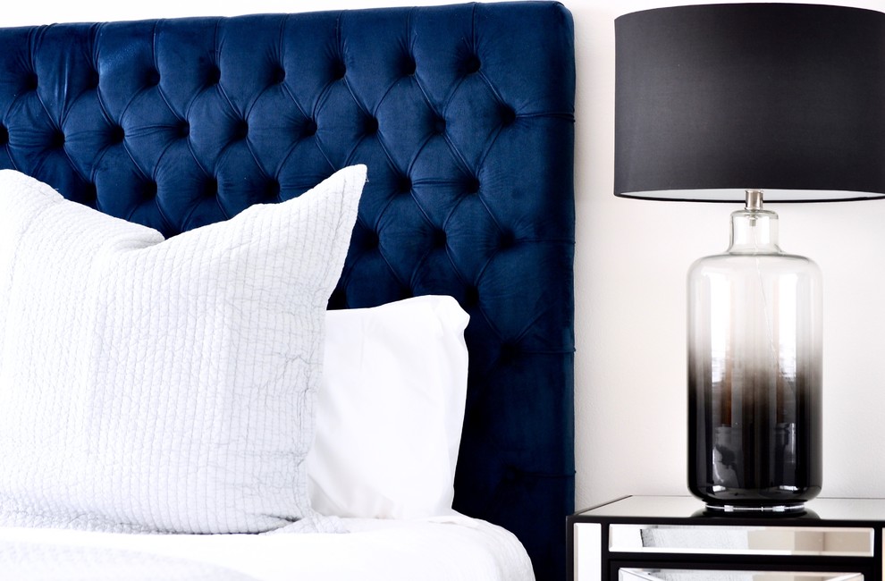 Design ideas for a mid-sized contemporary master bedroom in Sydney with white walls and medium hardwood floors.