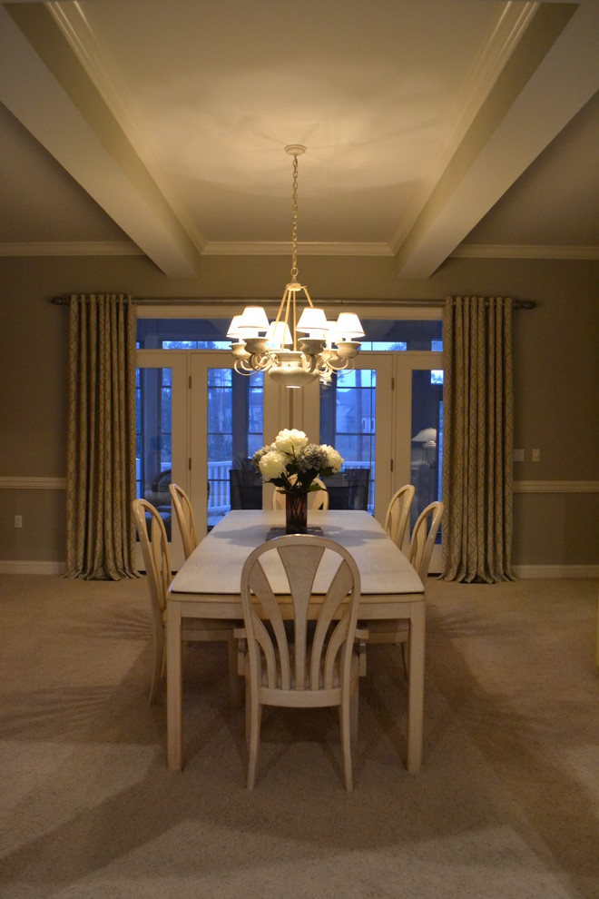 Inspiration for a large transitional carpeted dining room remodel with gray walls