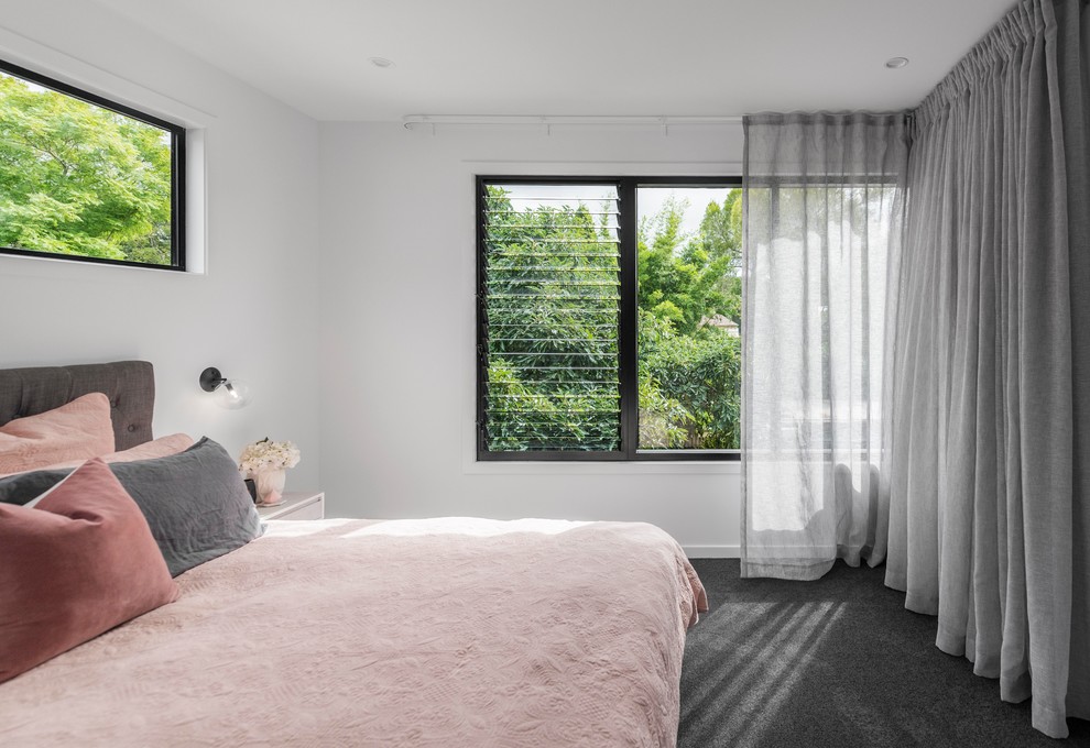Photo of a contemporary master bedroom in Brisbane with white walls, carpet and grey floor.