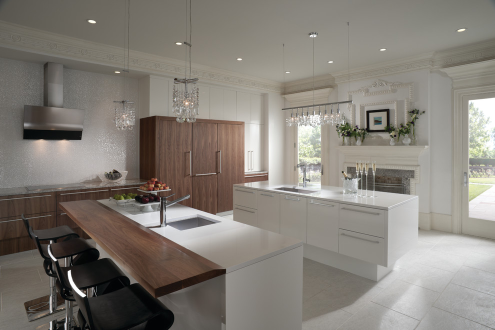 Photo of a large modern l-shaped eat-in kitchen in Houston with a single-bowl sink, flat-panel cabinets, brown cabinets, quartz benchtops, white splashback, porcelain splashback, stainless steel appliances, porcelain floors, multiple islands and grey floor.