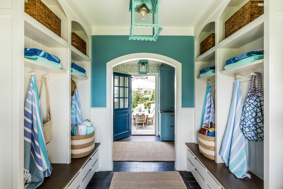Design ideas for a beach style mudroom in Bridgeport with blue walls and black floor.