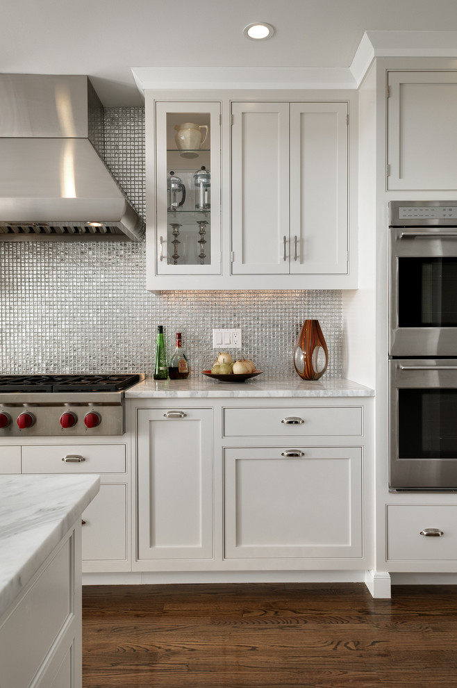Design ideas for a traditional eat-in kitchen in New York with metallic splashback, mosaic tile splashback, beaded inset cabinets, grey cabinets, marble benchtops and stainless steel appliances.