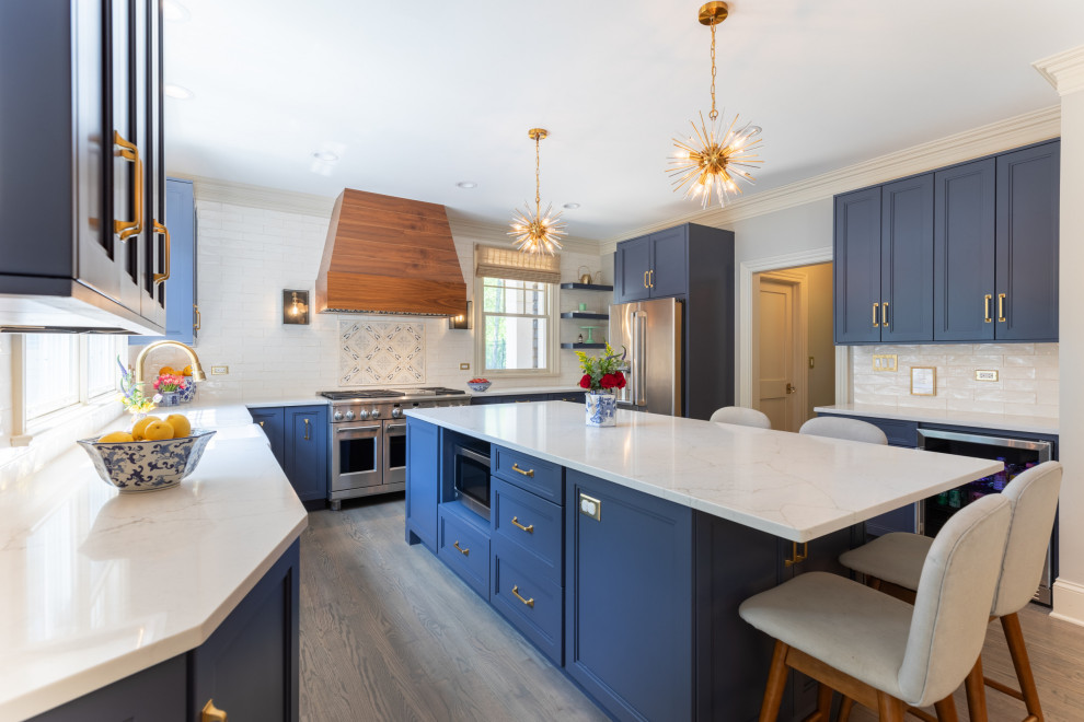 Kitchen RoomNavy & Walnut Kitchen With Gold Accents and Statement Lighting