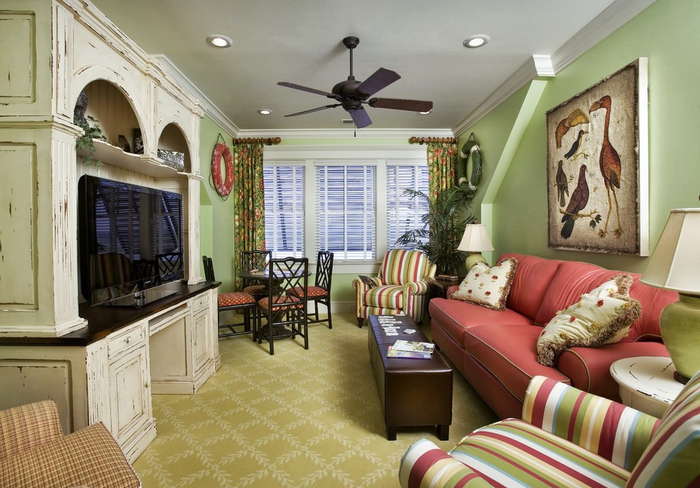 Design ideas for a beach style enclosed family room in Charleston with green walls, carpet, no fireplace, a freestanding tv and green floor.