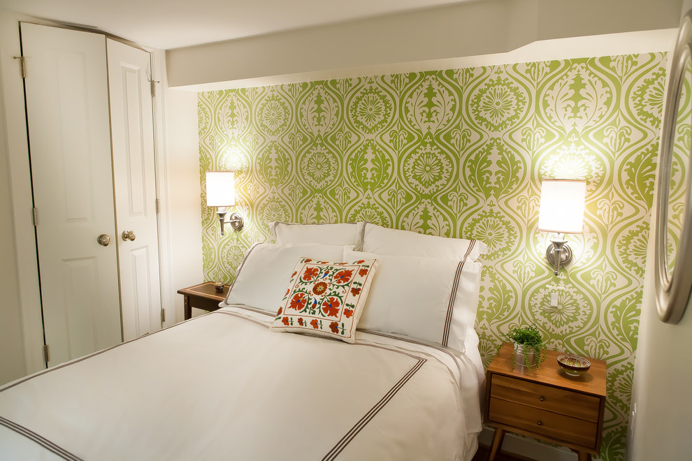 Photo of a mid-sized transitional guest bedroom in DC Metro with green walls, no fireplace and beige floor.