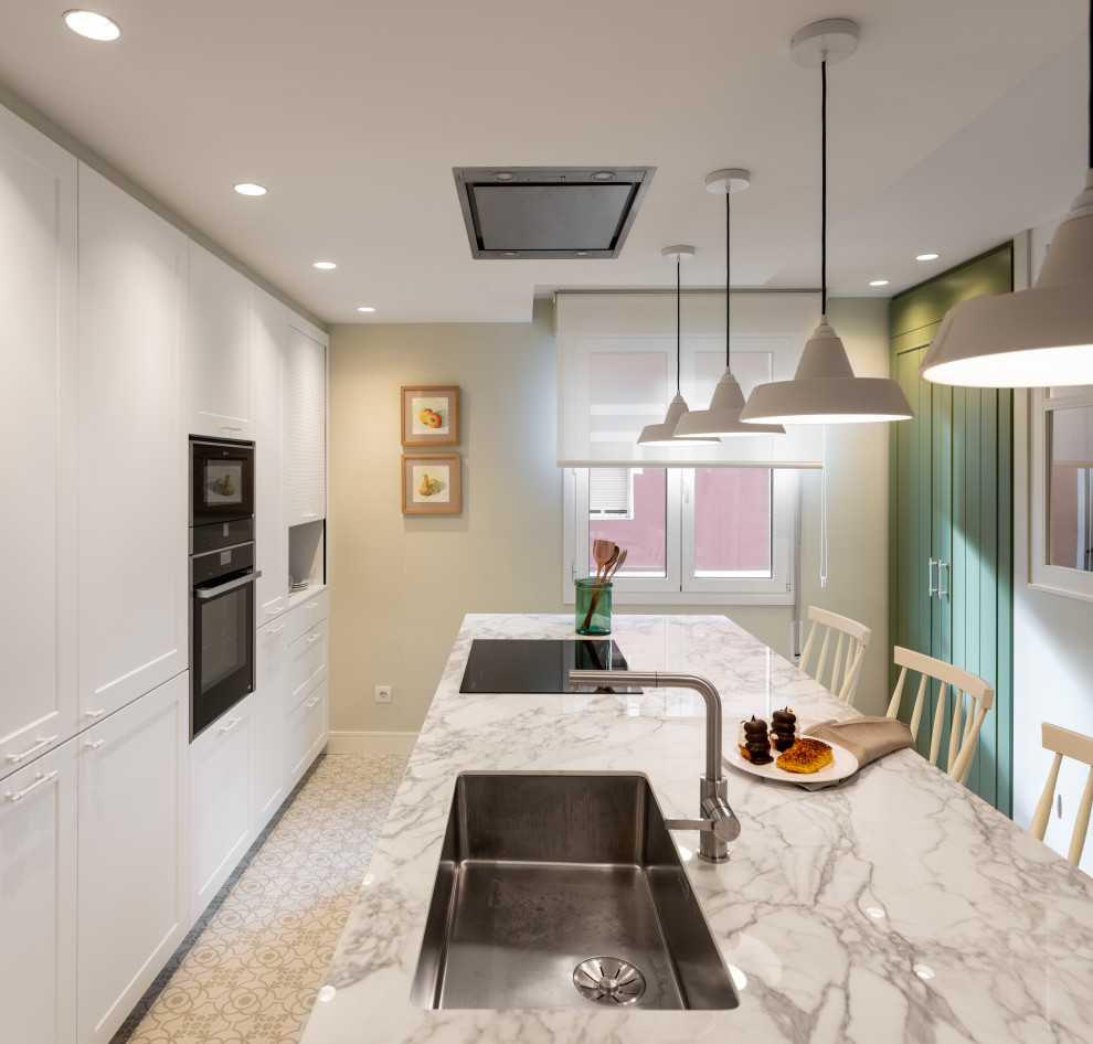 Design ideas for a large transitional kitchen in Other with an undermount sink, raised-panel cabinets, white cabinets, marble benchtops, black appliances, ceramic floors, with island, white floor and white benchtop.