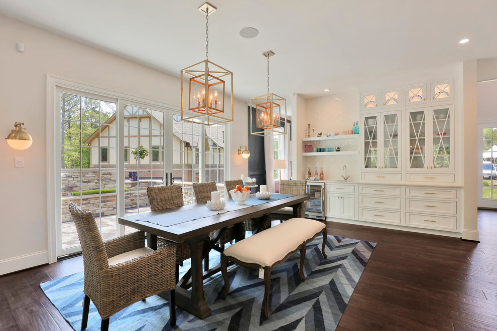 This is an example of a transitional dining room in Richmond with white walls and dark hardwood floors.