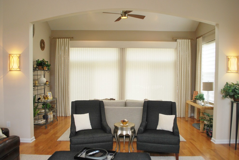 Inspiration for a large transitional open concept medium tone wood floor home design remodel in New York with beige walls