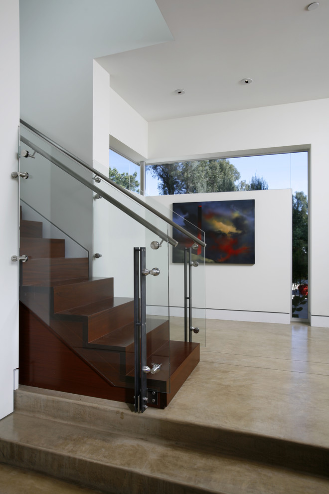 Modern wood staircase in Los Angeles with wood risers.